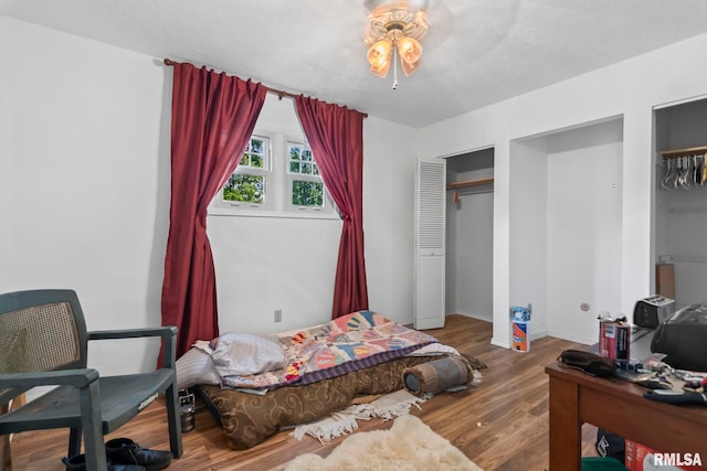 2924 Flowerbrook Ct, Springfield, IL 62702 - bedroom with wood finished floors and two closets
