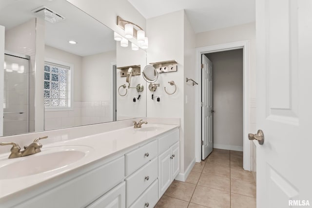 401 Cherry Cir, Williamsville, IL 62693 - full bath featuring double vanity, tile patterned flooring, and a shower with shower door