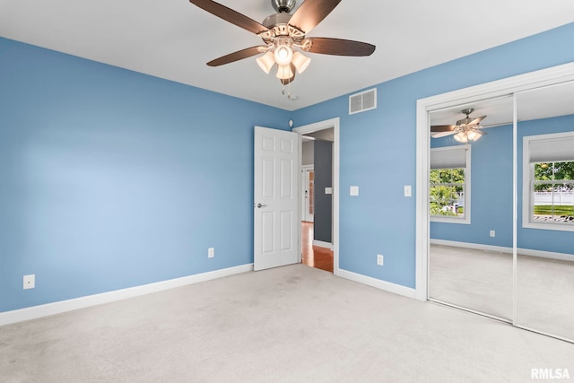 401 Cherry Cir, Williamsville, IL 62693 - unfurnished bedroom featuring carpet floors, a closet, and a ceiling fan