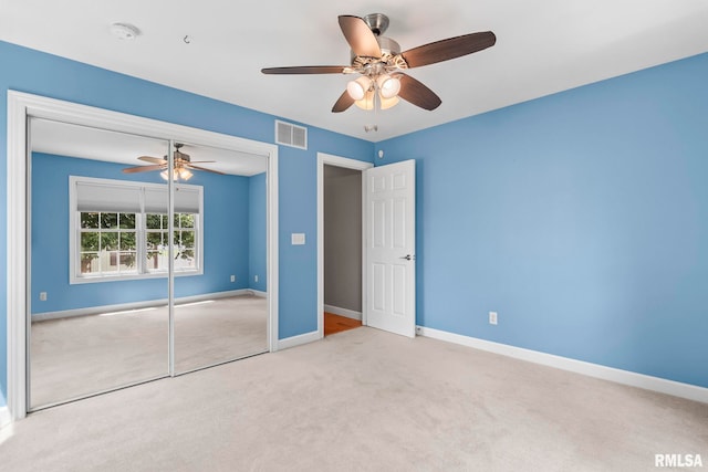 401 Cherry Cir, Williamsville, IL 62693 - unfurnished bedroom featuring carpet floors, a closet, and a ceiling fan
