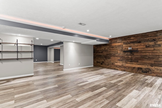 401 Cherry Cir, Williamsville, IL 62693 - unfurnished living room with wood walls, wood finished floors, and recessed lighting