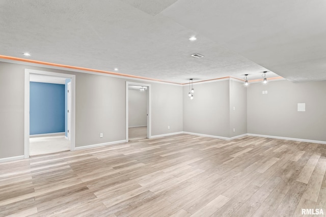 401 Cherry Cir, Williamsville, IL 62693 - spare room with crown molding, light wood-style flooring, recessed lighting, and a textured ceiling