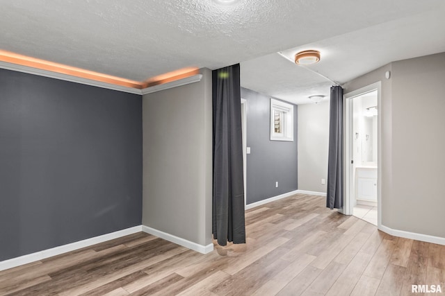 401 Cherry Cir, Williamsville, IL 62693 - spare room with wood finished floors, a textured ceiling, and a smoke detector
