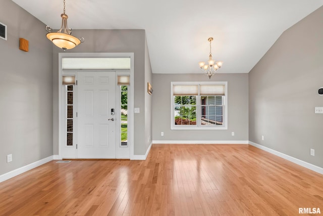 401 Cherry Cir, Williamsville, IL 62693 - foyer with a chandelier and light wood-style floors