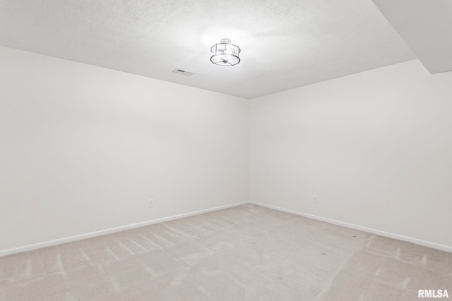 401 Cherry Cir, Williamsville, IL 62693 - spare room featuring light colored carpet and a textured ceiling
