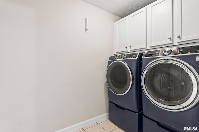 401 Cherry Cir, Williamsville, IL 62693 - washroom with cabinet space, washer and dryer, light tile patterned flooring, and a textured ceiling
