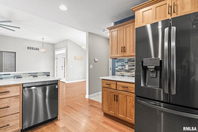 401 Cherry Cir, Williamsville, IL 62693 - kitchen featuring appliances with stainless steel finishes, backsplash, ceiling fan, light countertops, and light wood finished floors