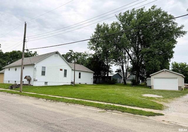 925 S 10th St, Havana, IL 62644 - view of property exterior featuring a garage, an outdoor structure, crawl space, and a lawn