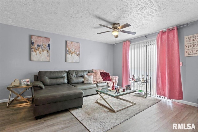 2900 Taylor Ave Unit 2, Springfield, IL 62703 - living area featuring wood finished floors, a ceiling fan, and a textured ceiling