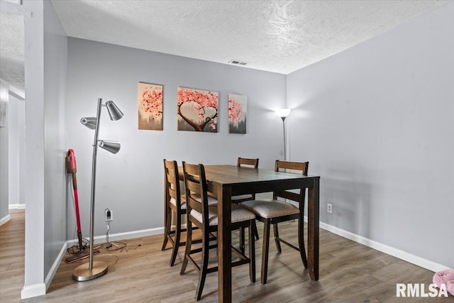 2900 Taylor Ave Unit 2, Springfield, IL 62703 - dining room with a textured ceiling and wood finished floors
