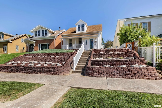 925 Payson Ave, Quincy, IL 62301 - view of front of property with stairway, a porch, and brick siding