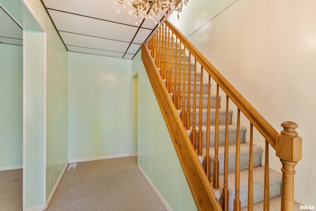 925 Payson Ave, Quincy, IL 62301 - stairway featuring carpet flooring and a chandelier