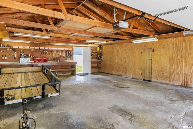 925 Payson Ave, Quincy, IL 62301 - garage with a garage door opener and a workshop area