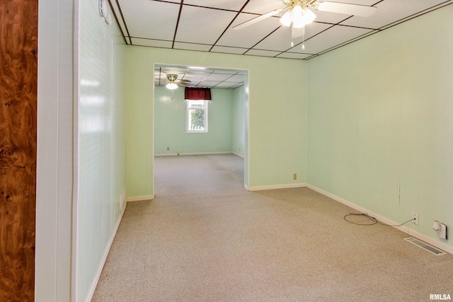 925 Payson Ave, Quincy, IL 62301 - unfurnished room with ceiling fan, light colored carpet, and a drop ceiling