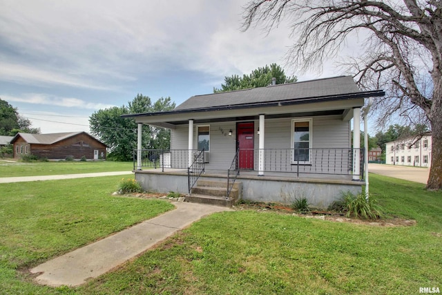 1940 Mulholland St, Nauvoo, IL 62354 - bungalow with covered porch, a front lawn, and roof with shingles