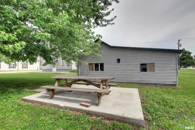 1940 Mulholland St, Nauvoo, IL 62354 - back of house featuring a lawn and a patio