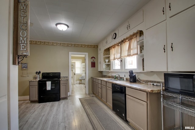 1940 Mulholland St, Nauvoo, IL 62354 - kitchen with black appliances, open shelves, light wood finished floors, and light countertops