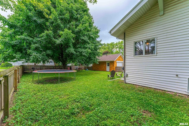 114 N Spring St, Mount Pulaski, IL 62548 - fenced backyard featuring a trampoline