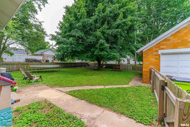 114 N Spring St, Mount Pulaski, IL 62548 - fenced backyard with a trampoline