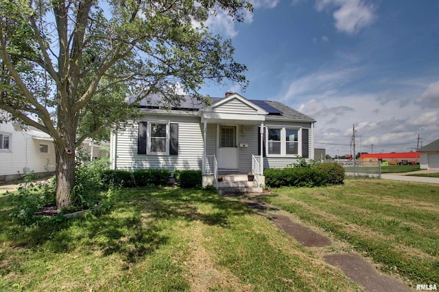 1421 N 13th St, Quincy, IL 62301 - bungalow featuring a front lawn and solar panels