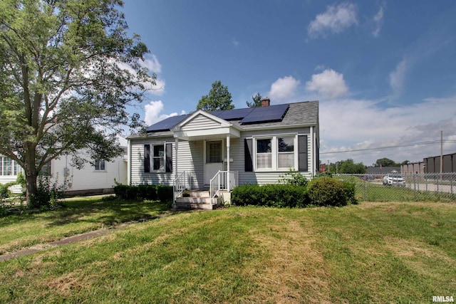 1421 N 13th St, Quincy, IL 62301 - view of front of home with a chimney and solar panels
