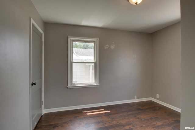 1421 N 13th St, Quincy, IL 62301 - unfurnished room featuring dark wood finished floors and baseboards