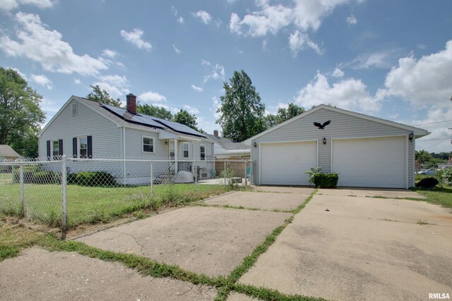 1421 N 13th St, Quincy, IL 62301 - view of front of property with an outbuilding, a detached garage, and a chimney