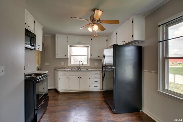 1421 N 13th St, Quincy, IL 62301 - kitchen with black appliances, ceiling fan, plenty of natural light, and white cabinets