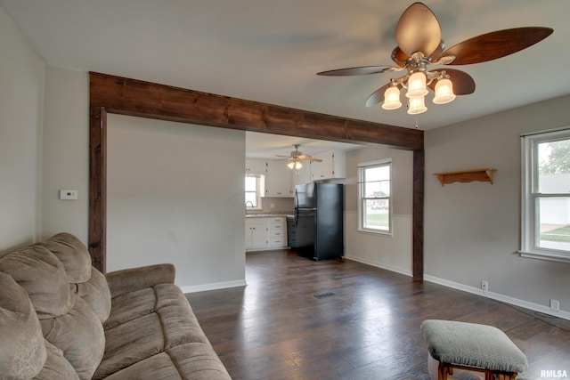 1421 N 13th St, Quincy, IL 62301 - living room with a ceiling fan, dark wood-type flooring, and beamed ceiling