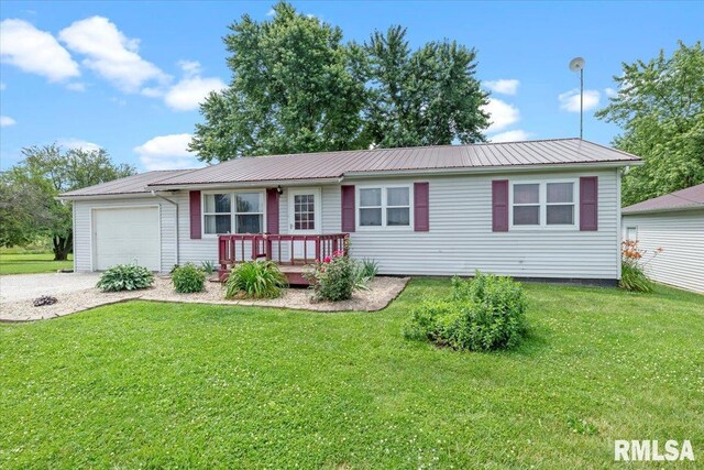 19581 Finney Rd, Girard, IL 62640 - ranch-style home featuring a garage, a metal roof, a deck, and a front lawn