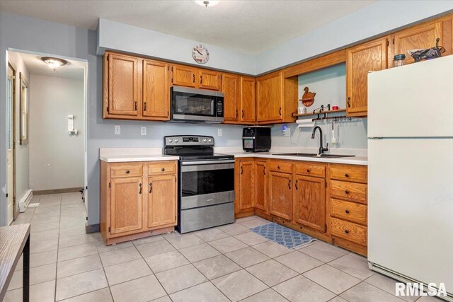 19581 Finney Rd, Girard, IL 62640 - kitchen featuring stainless steel appliances, light countertops, open shelves, and light tile patterned floors