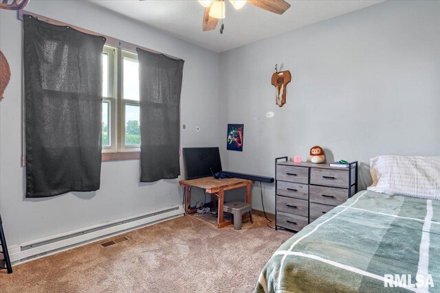 19581 Finney Rd, Girard, IL 62640 - bedroom featuring carpet, a baseboard heating unit, and ceiling fan