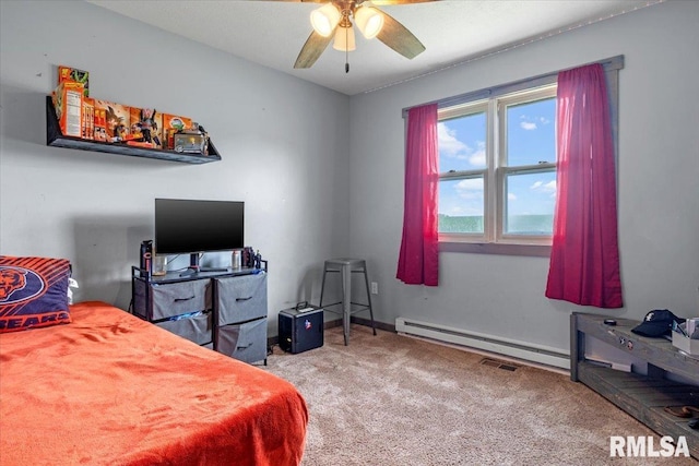 19581 Finney Rd, Girard, IL 62640 - bedroom featuring carpet floors, baseboard heating, and a ceiling fan