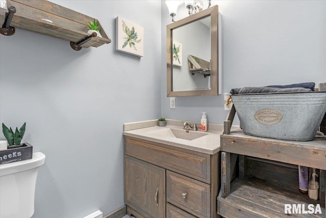 19581 Finney Rd, Girard, IL 62640 - half bathroom featuring toilet and vanity