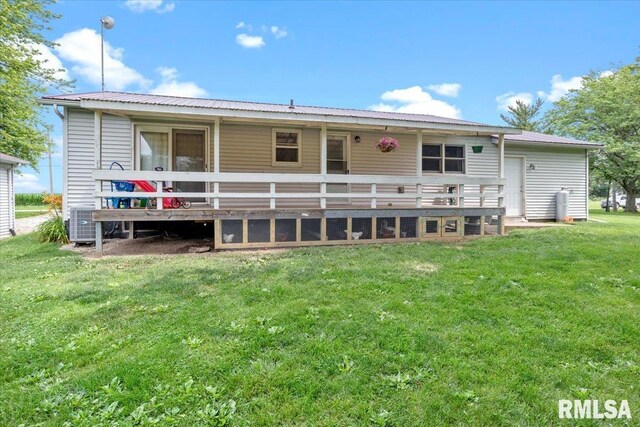 19581 Finney Rd, Girard, IL 62640 - rear view of house with a yard, a metal roof, and a wooden deck