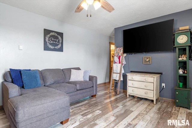 19581 Finney Rd, Girard, IL 62640 - living room featuring ceiling fan and light wood-style flooring