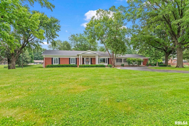 880 Old Tipton School Rd, Sherman, IL 62684 - ranch-style house with driveway, a front lawn, brick siding, and an attached carport