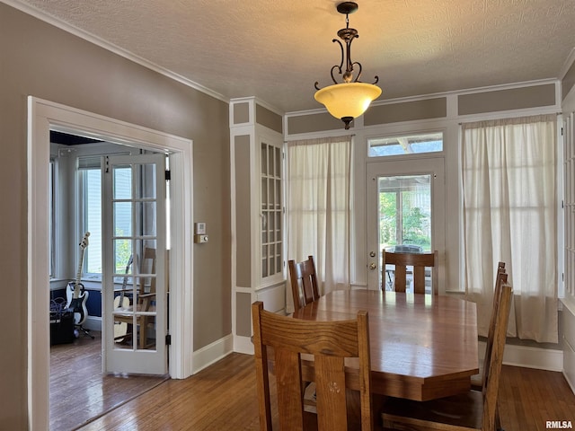 814 N Prairie St, Galesburg, IL 61401 - dining space with a textured ceiling, hardwood / wood-style floors, plenty of natural light, and ornamental molding