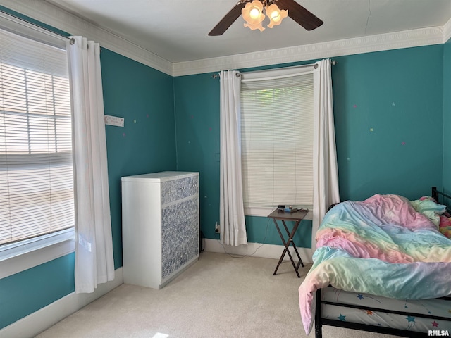 814 N Prairie St, Galesburg, IL 61401 - carpeted bedroom featuring multiple windows and ceiling fan
