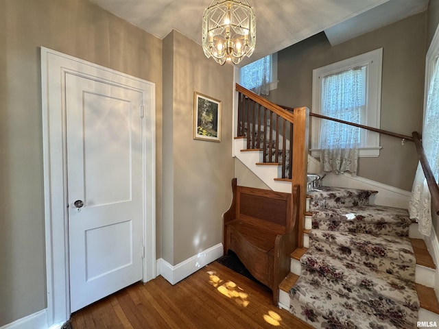 814 N Prairie St, Galesburg, IL 61401 - staircase featuring wood finished floors and a chandelier