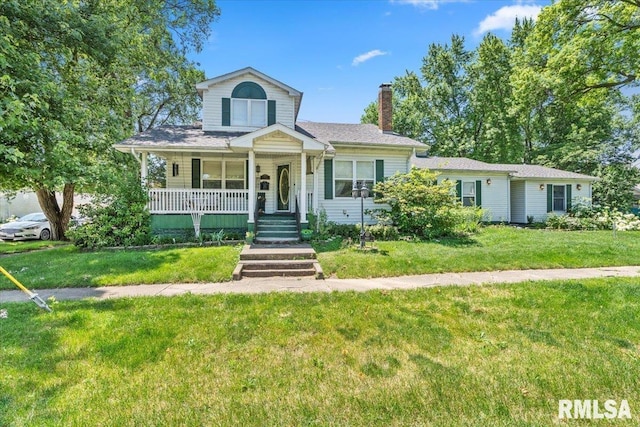 603 W Jefferson St, Auburn, IL 62615 - view of front facade featuring a chimney, covered porch, and a front lawn