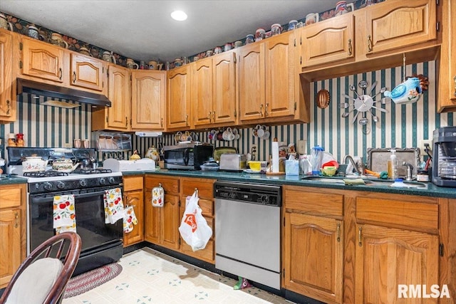 603 W Jefferson St, Auburn, IL 62615 - kitchen featuring dishwashing machine, black range with gas stovetop, stainless steel microwave, under cabinet range hood, and dark countertops