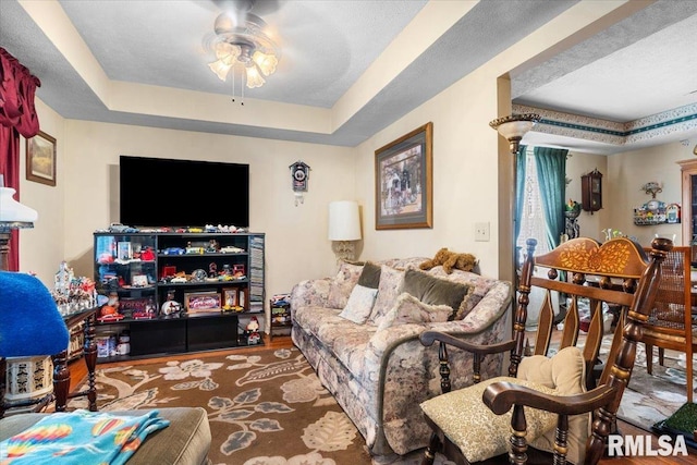 603 W Jefferson St, Auburn, IL 62615 - living room featuring a raised ceiling and ceiling fan