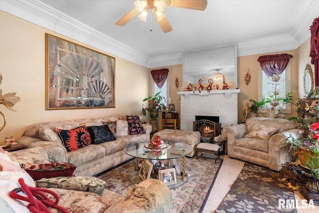 603 W Jefferson St, Auburn, IL 62615 - living room featuring a ceiling fan, a fireplace, crown molding, and plenty of natural light