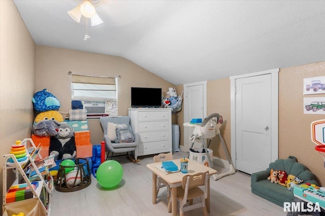 603 W Jefferson St, Auburn, IL 62615 - playroom featuring wood finished floors, cooling unit, and vaulted ceiling