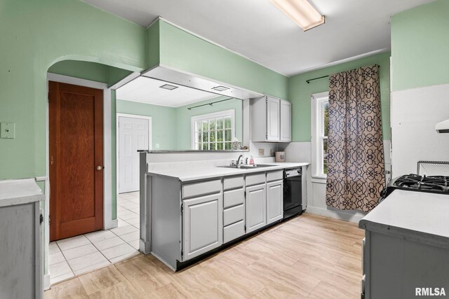 2535 S 8th St, Springfield, IL 62703 - kitchen with black dishwasher, light countertops, a peninsula, and stove