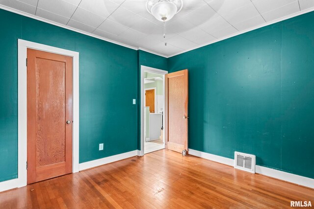 2535 S 8th St, Springfield, IL 62703 - spare room featuring wood finished floors and crown molding