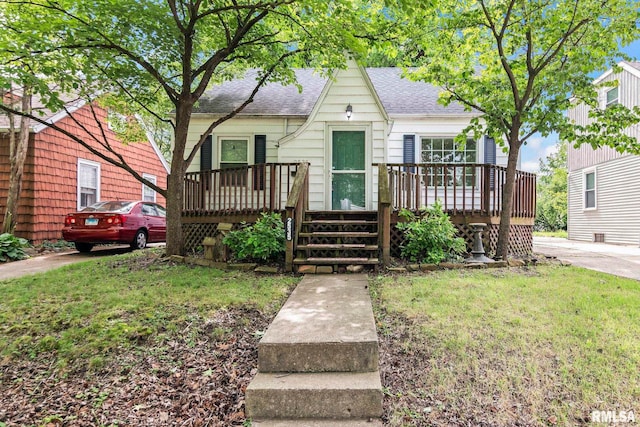 2535 S 8th St, Springfield, IL 62703 - view of front of home with a shingled roof, a wooden deck, and a front yard