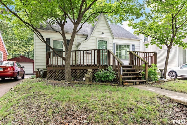 2535 S 8th St, Springfield, IL 62703 - view of front facade with roof with shingles, a wooden deck, and a garage