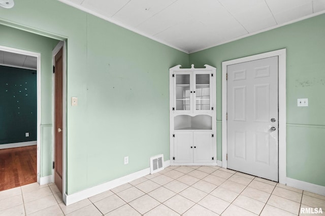2535 S 8th St, Springfield, IL 62703 - foyer with crown molding and light tile patterned floors